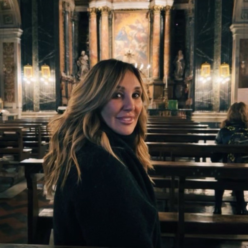 Nicole Daedone seated inside a church