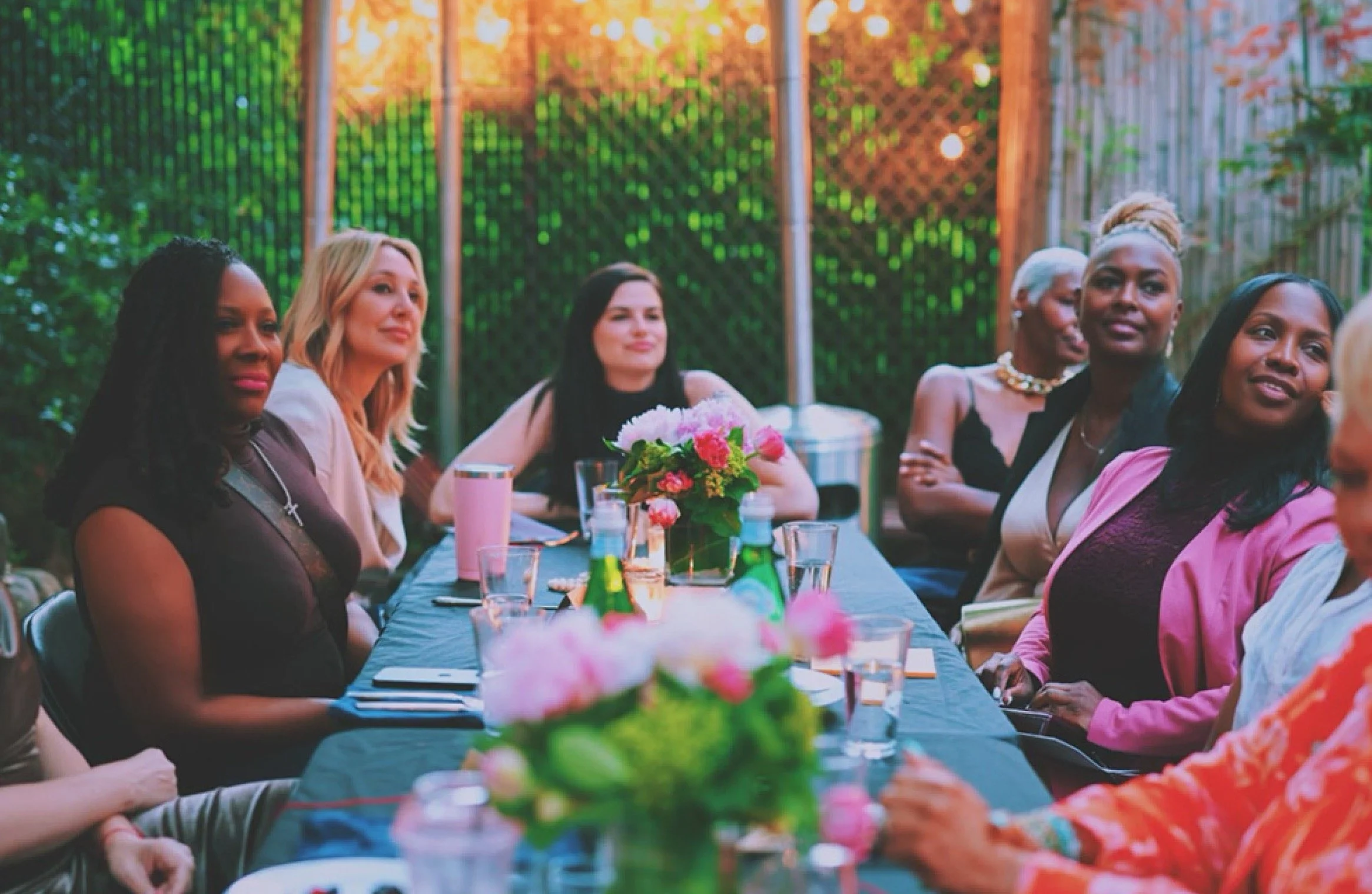 Women gathered around a Women Over Dinner table.